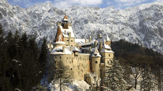 Bran, Romania - January 24, 2010 : Dracula's Bran Castle in winter with snow and Piatra Craiului (Carpathians) mountains. credit: istock one time use for Traveller only